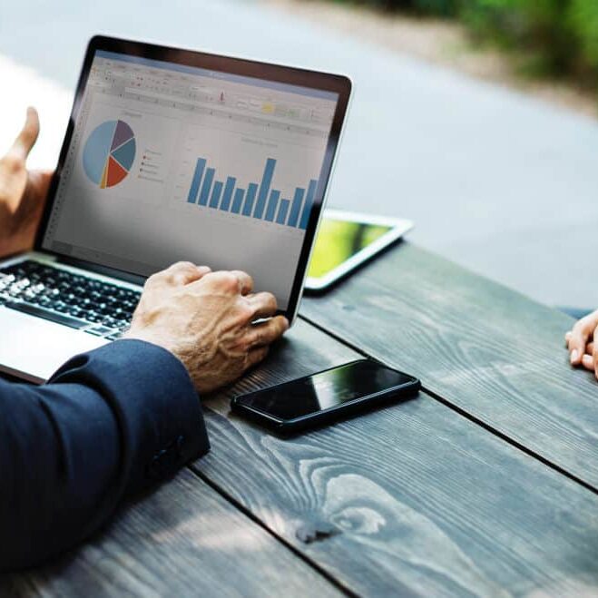 businessman reviewing reports with client