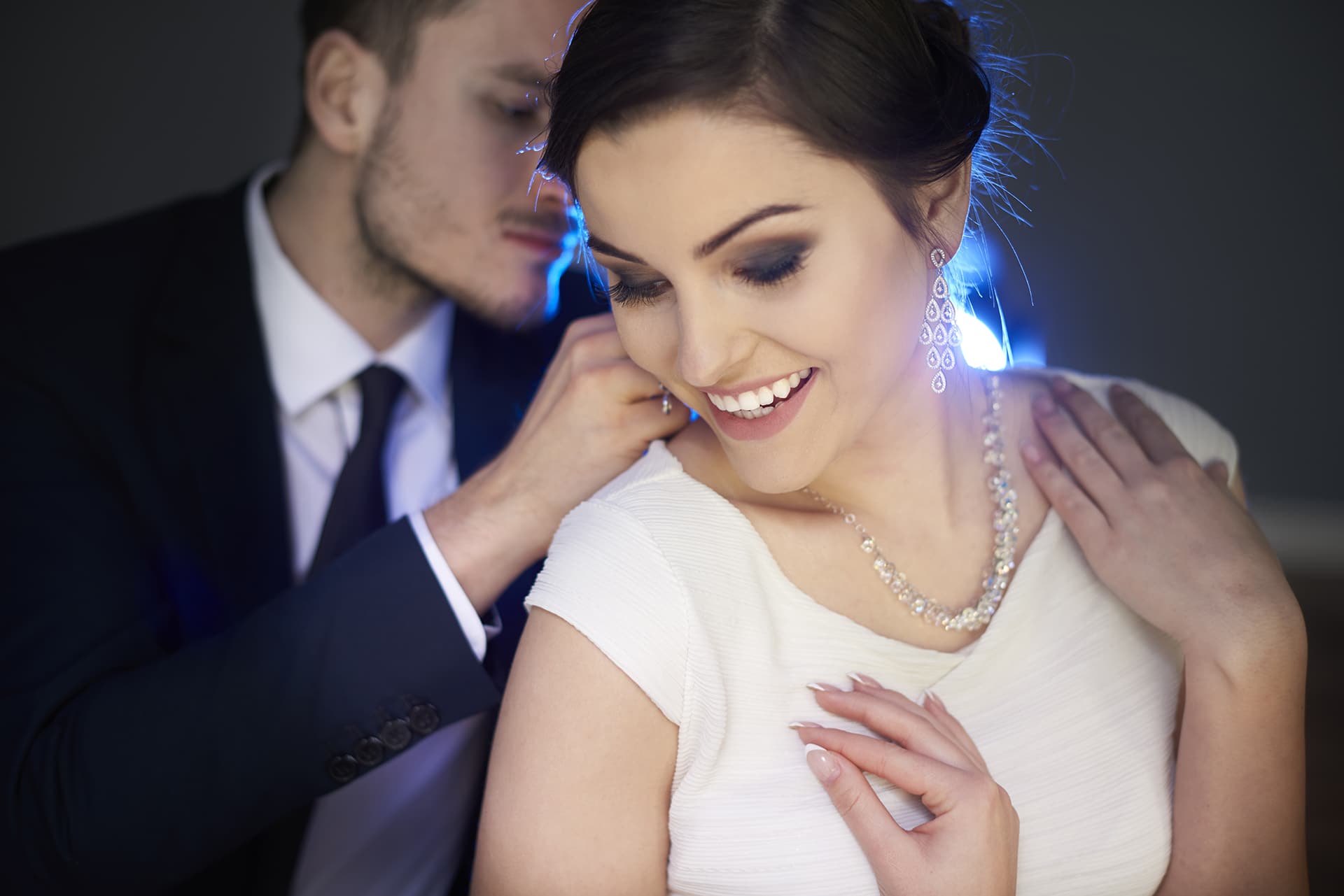 Loving man putting necklace on girlfriend — Ethic Advertising LLCAll Rights Reserved